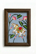 Painting of a white elephant in gold jewellery and a crimson saddlecloth