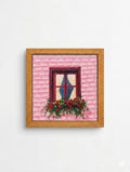 Framed miniature painting of a rustic window with roses